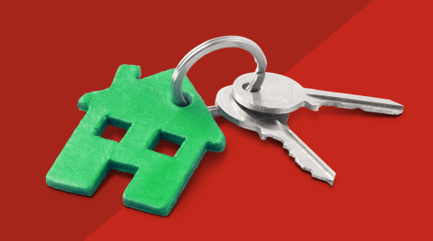 Duas chaves com porta-chaves que ilustra uma casa verde.